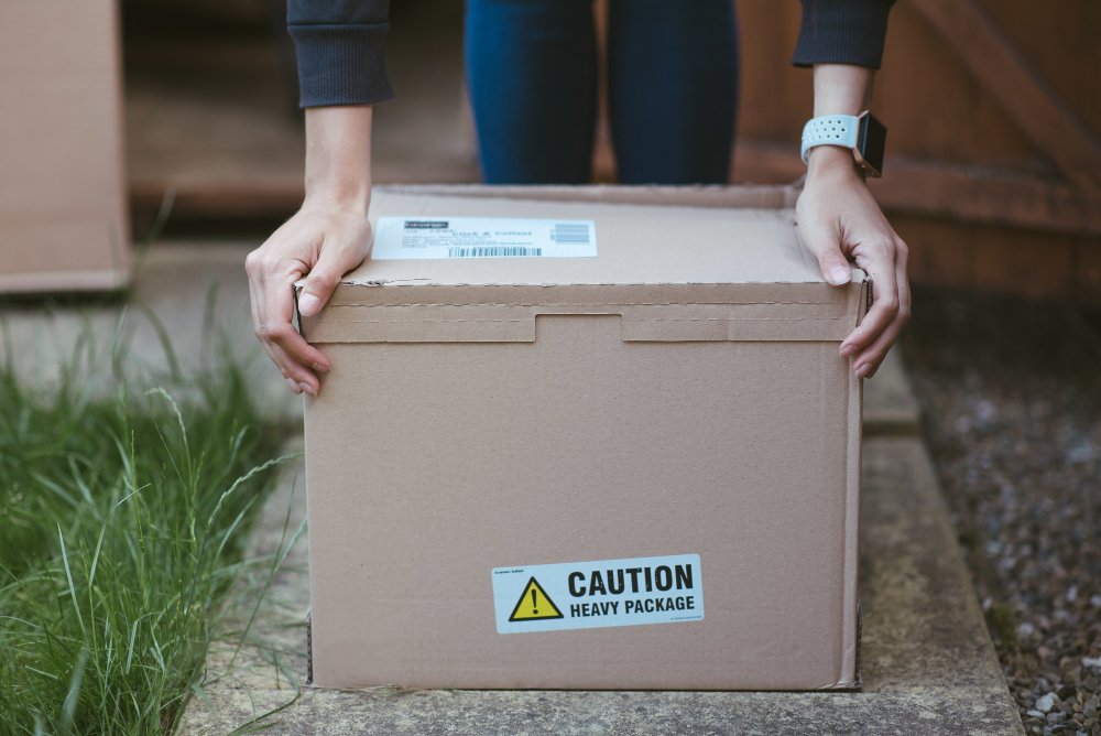 A plain sealed shipping box with a tracking label